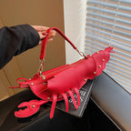 Lobster shape studded crossbody bag