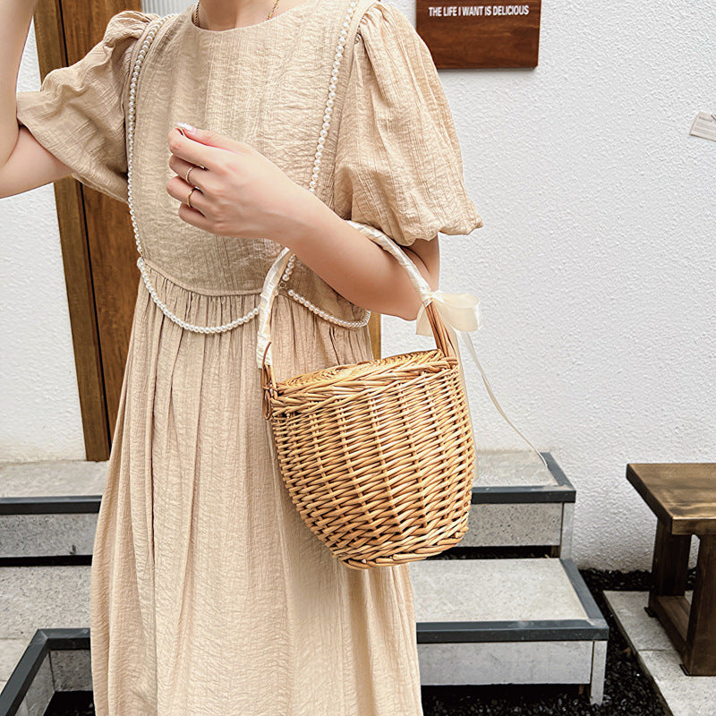 Rattan, wicker, and bamboo hand-woven French basket bag