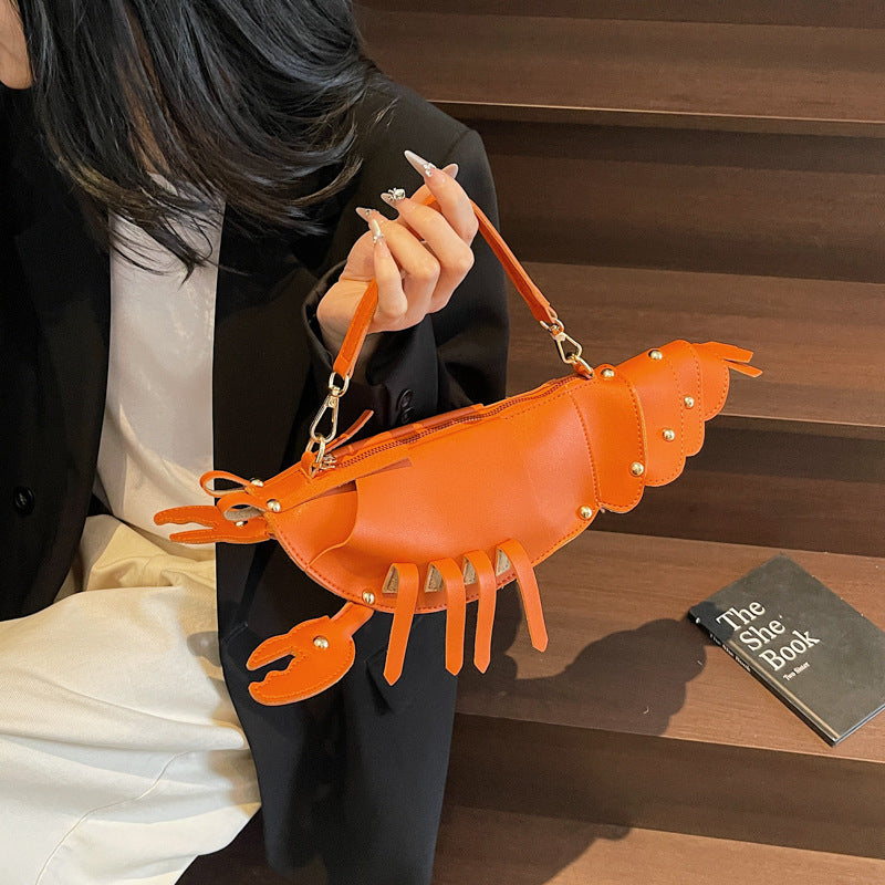 Lobster shape studded crossbody bag